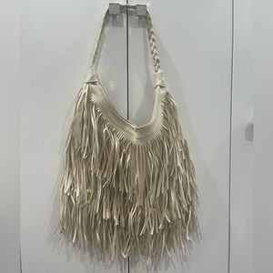 New cream fringe purse. Never used super cute